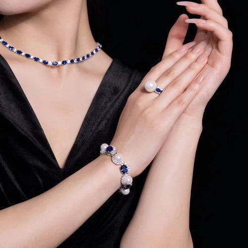 Lady wearing blue sapphire and pearl bracelet