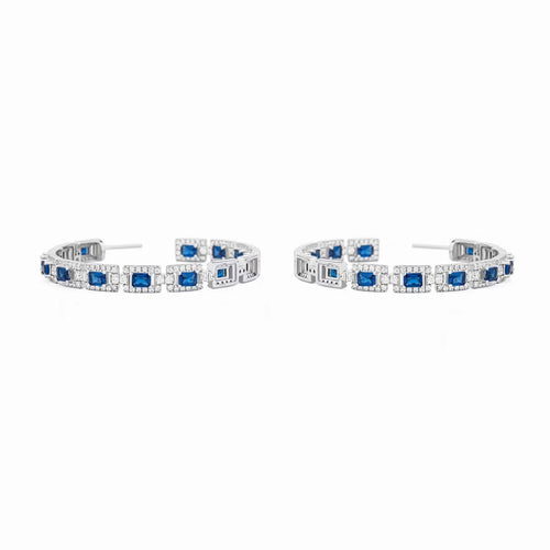 front view of Blue sapphire silver drop earrings with moissanite