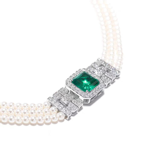 side view of Emerald and pearl necklace with moissanites