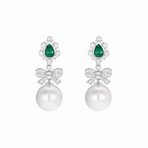 Created pearl drop earrings with emerald in silver