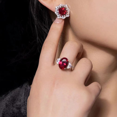 lady wearing Cabuchon red zircon silver halo earrings