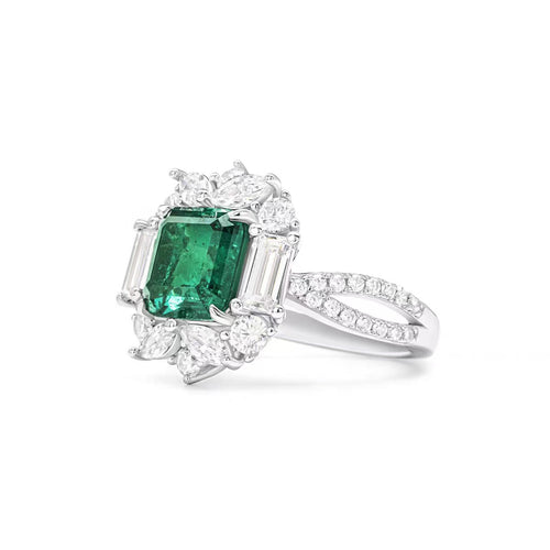 profile view of Emerald engagement ring with moissanite halo in silver