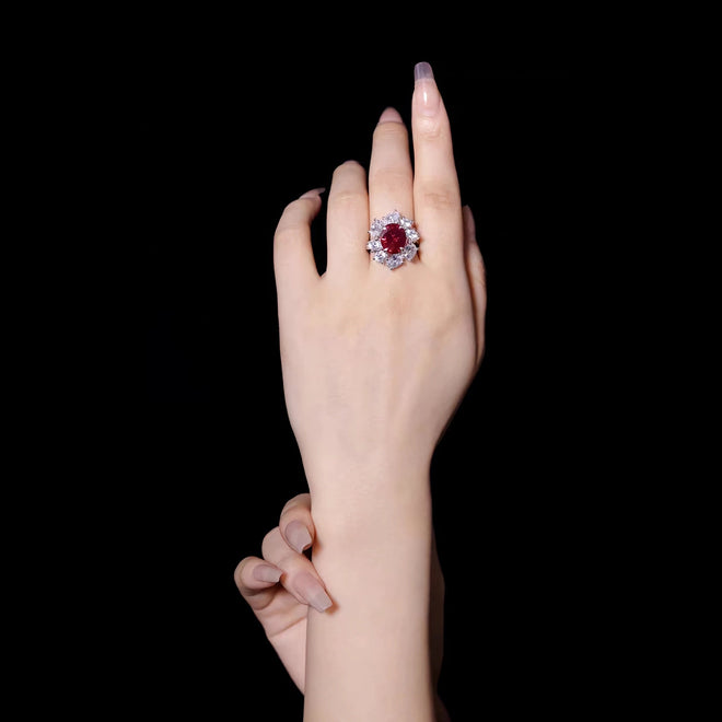 lady wearing Red oval zircon halo engagement ring