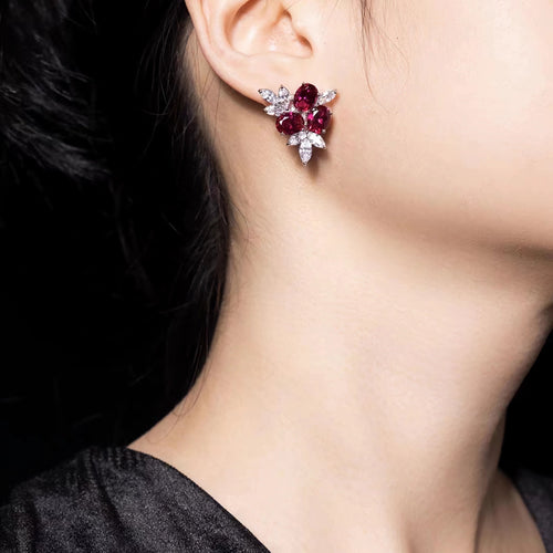 lady wearing Oval red zircon silver earrings with marquise accent