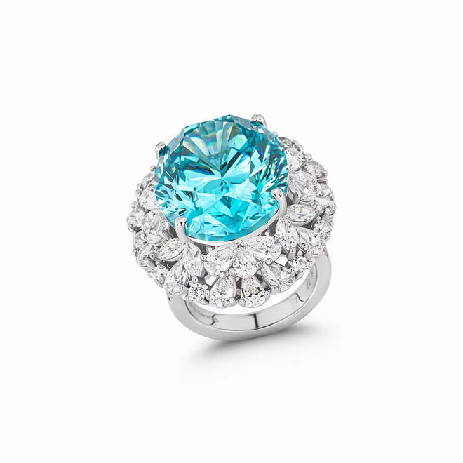 profile view of Blue cubic zirconia engagement ring with halo in silver