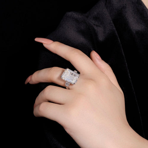 lady wearing Engagement Ring With Emerald Cut White Zircon Statement Ring Silver