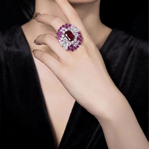 lady wearing Red zircon fancy silver statement ring  