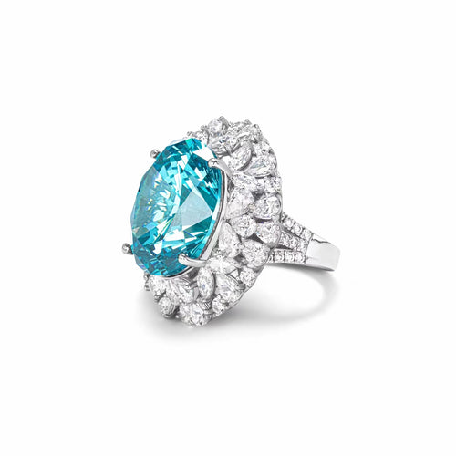 side view of Blue cubic zirconia engagement ring with halo in silver