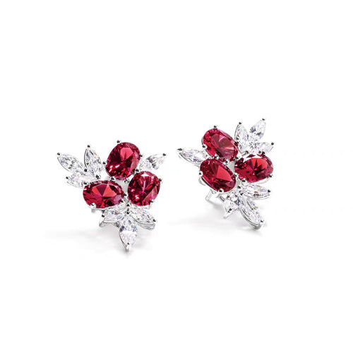 top view of Oval red zircon silver earrings with marquise accent