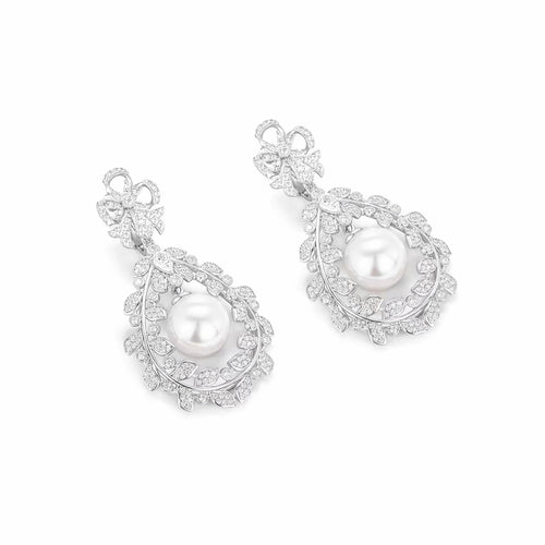 side view of Pearl drop earrings in floral design