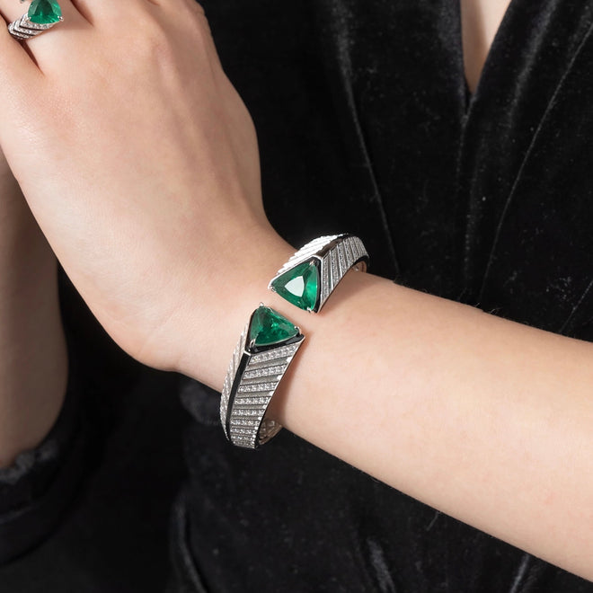 lady wearing Trillion green zircon silver bangle