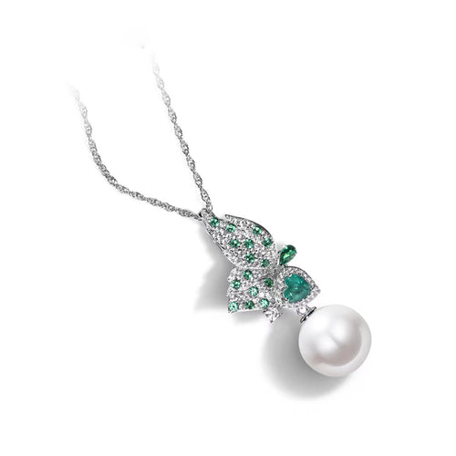 side view of White pearl silver necklace with green zircon