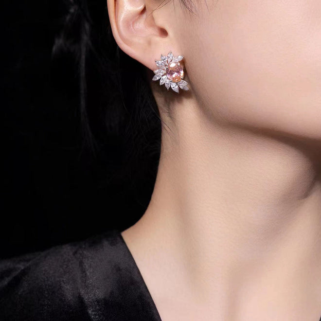 lady wearing Oval orange zircons earrings with marquise pavé