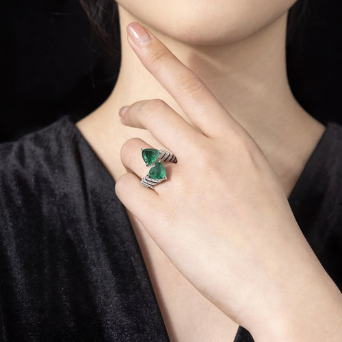 lady wearing Two-stone trillion emerald statement ring